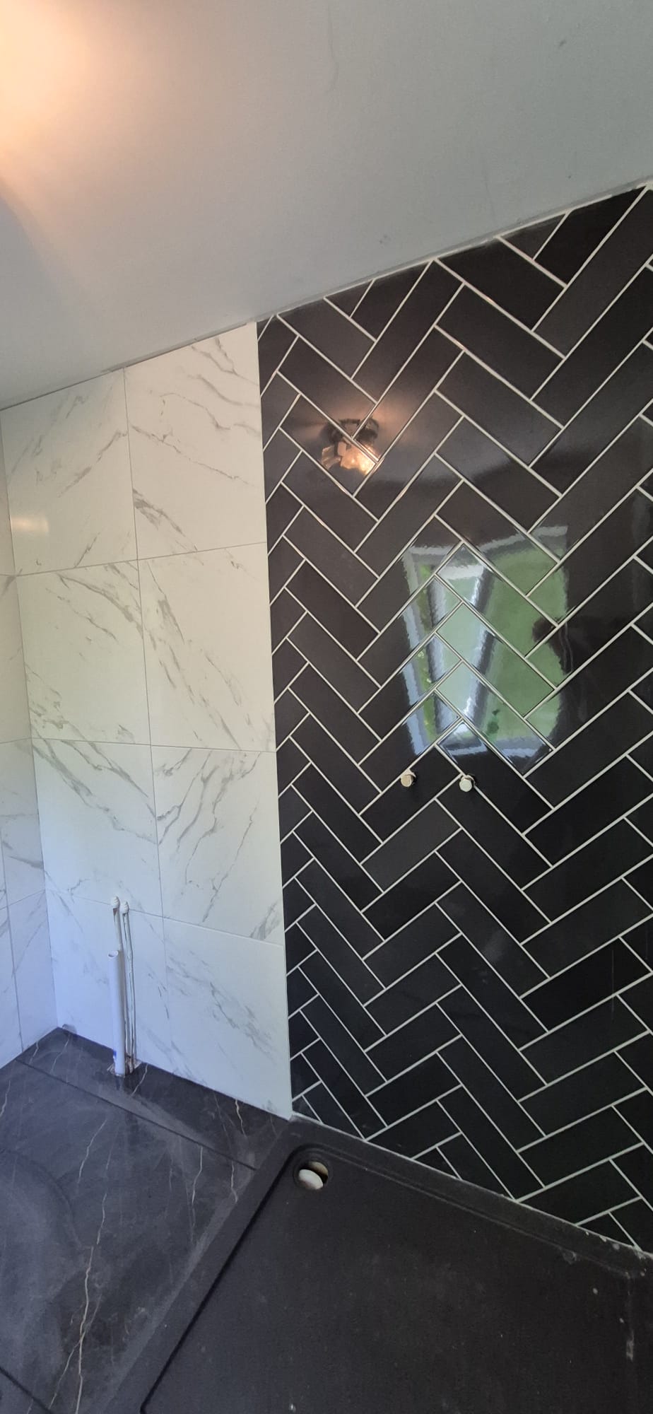 Project: White Marble + Herringbone Wall in shower area